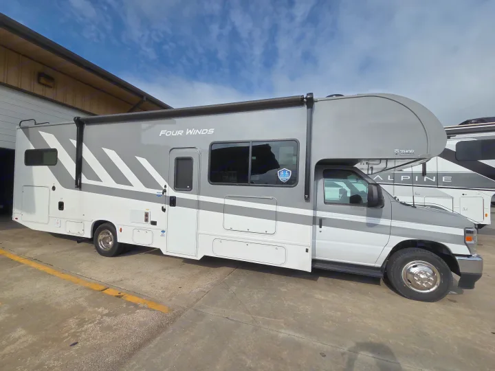 This Four Winds RV rental offers a spacious motorhome for your next adventure, perfect for outdoor recreation & travel.. Four Winds 31E 2026