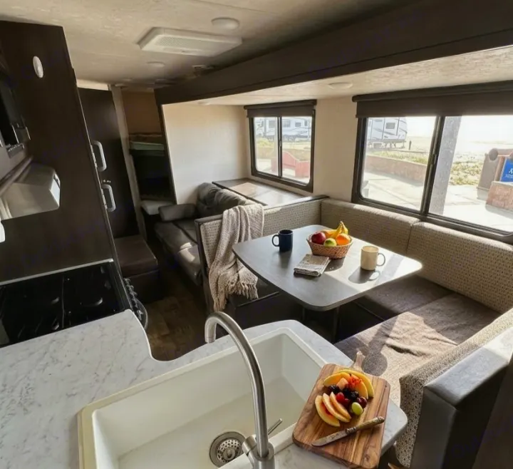 Experience a spacious rv rental with a fully equipped kitchen, comfortable dining area, and cozy living space.. Forest River Salem Cruise Lite 2019