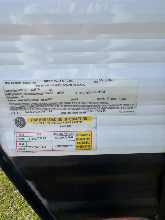 RV rental travel trailer specs: safety label with VIN, GVWR, tire size (ST235/75R15), and 65 PSI cold tire pressure details.. Wayfinder RV Go lite 2025