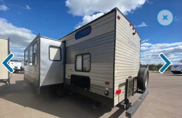 Exterior view of a travel trailer RV rental with a slide-out, ready for your next adventure.. Forest River Cherokee 2018