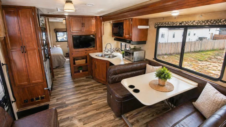 This RV rental offers a well-appointed interior with a kitchen, dining booth, living area, and bedroom. See your next adventure here!. Coachmen Pursuit 2014