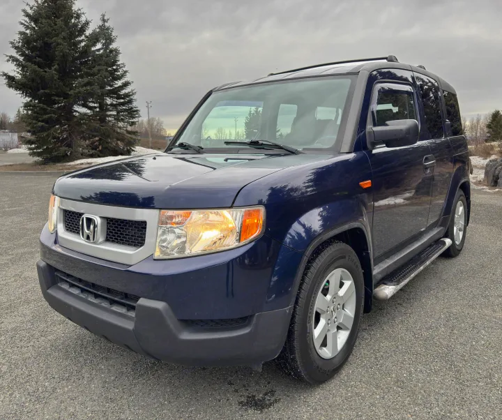 Blue Honda Element, a compact SUV for vehicle rental trips, distinct from an RV rental.. Honda Element 2010