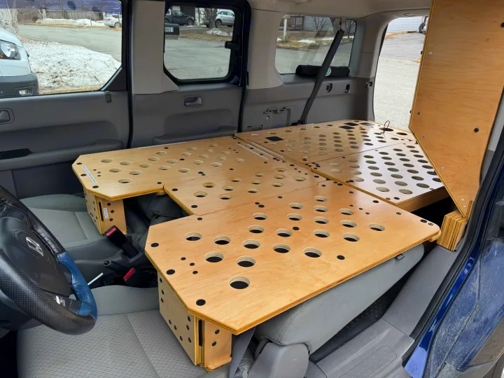 Custom modular wooden sleeping platform inside a car, perfect for an RV rental or car camping adventure.. Honda Element 2010