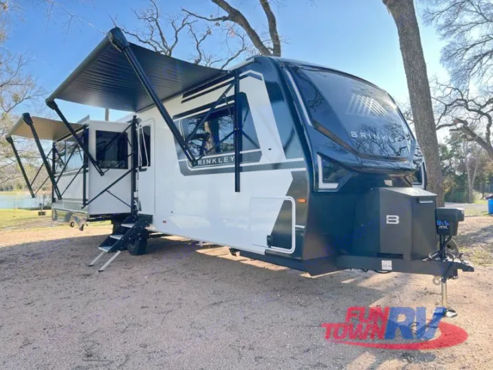 Modern Brinkley RV rental travel trailer set up with extended awnings. Perfect for your next outdoor adventure.. Brinkley Air 295 2025