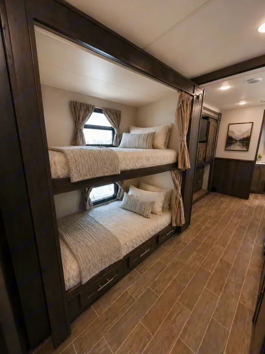 Cozy RV rental interior featuring comfortable bunk beds with windows and integrated storage. Perfect for family adventures.. Forest River Georgetown 2020