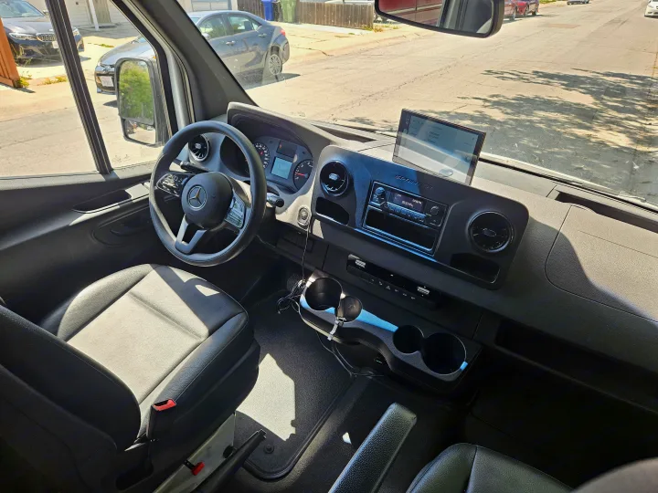 RV rental: Mercedes Sprinter van's interior. Driver's view of dashboard, steering wheel, and navigation to Vancouver/Fremont.. Mercedes Benz Sprinter 2020