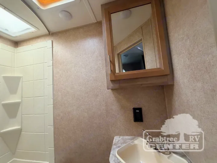 Bright RV rental bathroom with shower, skylight, vanity sink, and mirrored cabinet. Ready for your adventure.. Coachmen Other 2020