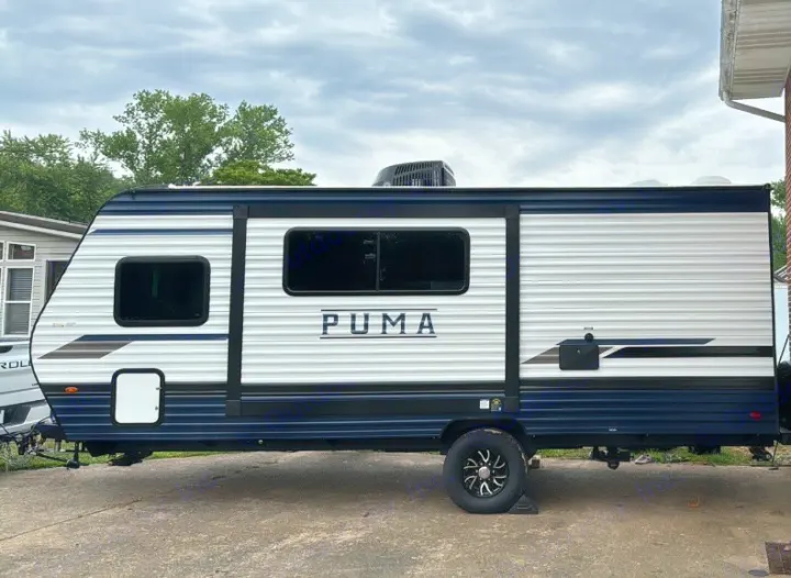 Modern Puma travel trailer in white and blue, available for rv rental. Perfect for your next camping trip or road adventure.. Puma Palomino 2024
