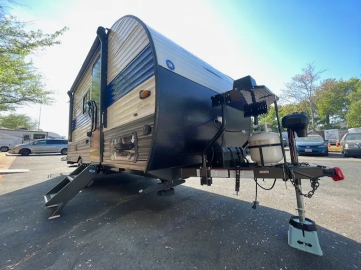 Ready for adventure! This sleek travel trailer rv rental, with a propane tank, steps, and awning, awaits your next journey.. Coachmen Clipper 2025