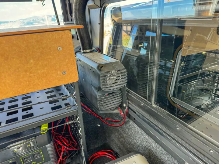 Cozy rv rental interior: Truma VarioHeat, Goal Zero power station, and organized wiring for off-grid adventure.. Toyota Tacoma 2026