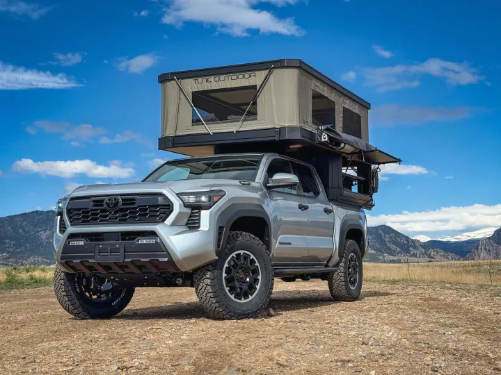 Adventure awaits with this RV rental! A rugged Toyota Tacoma with Tune Outdoor rooftop tent & camper for overlanding.. Toyota Tacoma 2026