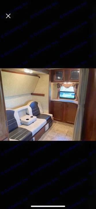 Check out this RV rental! Features a comfortable sofa with cupholders, overhead bunk, window, and storage cabinetry.. Forest River Tracer Executive 2010
