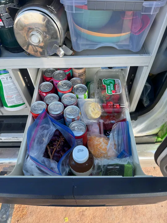 RV rental: A pull-out drawer full of beverages, fresh fruit like strawberries and grapes, cheese, and other snacks.. Ford Econoline 150 2012