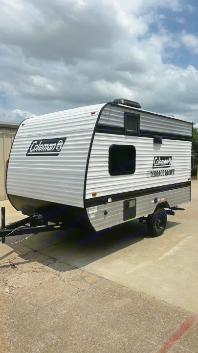 White and grey Coleman travel trailer with black trim, ideal for your rv rental camping trip.. Keystone RV 13B travel Trailer 2026