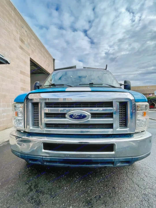 Front view of a blue Ford utility truck. Explore our other rental options, including RV rental for your adventures.. Ford E350 2010