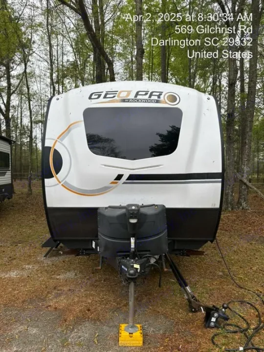 Front view of a white and black Geo Pro by Rockwood travel trailer, perfect for an RV rental camping trip.. Forest River Rockwood Geo Pro 2022