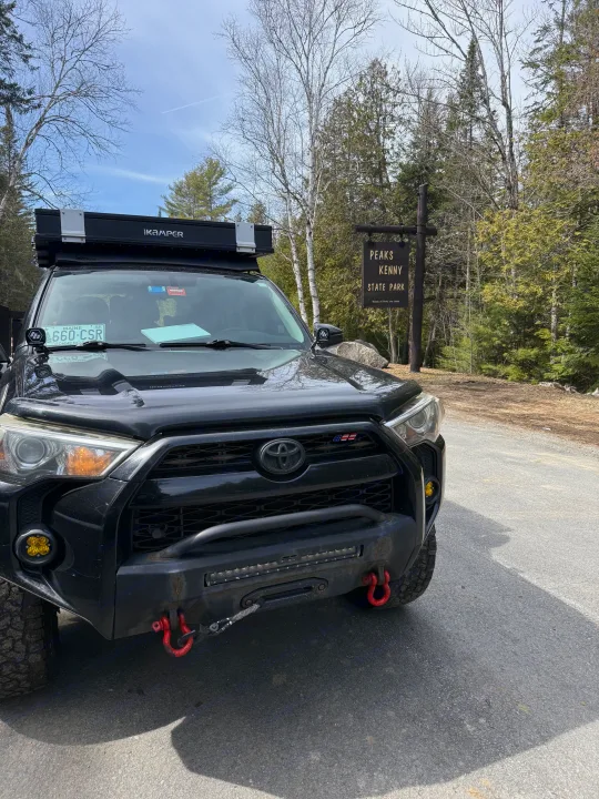 Black Toyota 4Runner with iKamper rooftop tent, perfect for an adventurous rv rental trip, at Peaks Kenny State Park.. Toyota 4Runner 2014