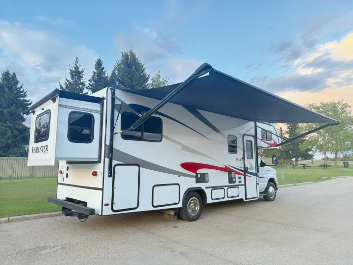 This Class C RV rental, a Forester by Forest River, is parked with its slide-out and awning extended, ready for adventure.. Forester 2501CD 2023