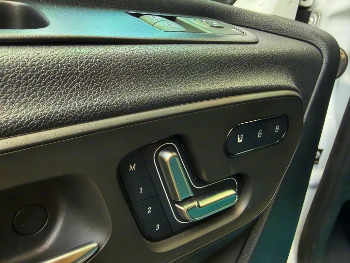 Close-up of driver's door controls in an rv rental: seat memory presets, heated seat, and door lock/unlock for optimal comfort.. Coachmen Prism 2026
