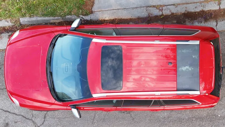 Red SUV with roof rails and sunroof, overhead view. Excellent for an RV rental alternative adventure.. Volvo xc90 2014