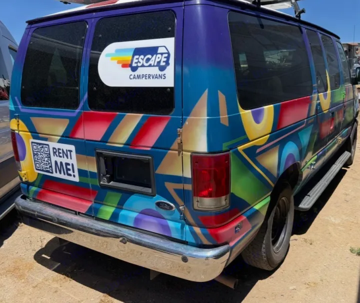Brightly painted Escape Campervans RV rental, featuring a "Rent Me!" QR code on the back for easy booking.. Ford E350 Box Van 2013