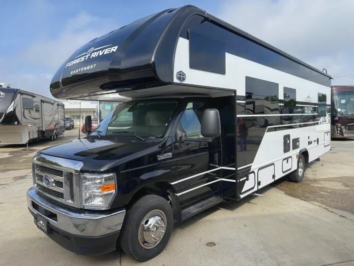 Sleek black & white Forest River Class C RV available for rental. Explore the open road in style and comfort.. 2027