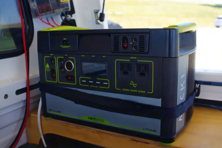 A black Goal Zero Yeti 1000 Lithium portable power station in an rv rental. It features AC/USB ports, 1500W, perfect for camping.. Ford Ford F150 2017