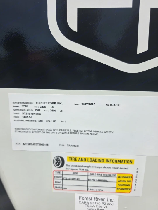 RV rental vehicle info label: Forest River manufacturing specs, tire pressure (65 PSI), and weight limits are clearly displayed.. Forest River Rockwood Geo Pro 2026