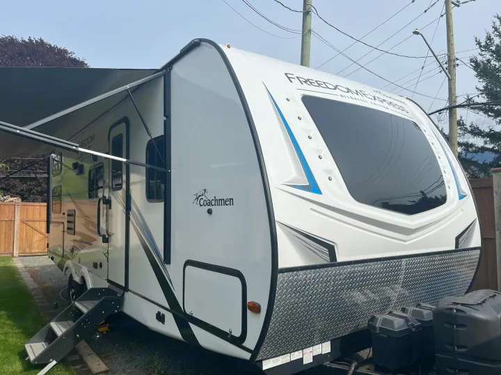 This pristine white Coachmen Freedom Express RV rental, with its extended awning, is perfect for your next road trip.. Coachmen freedom express 2021