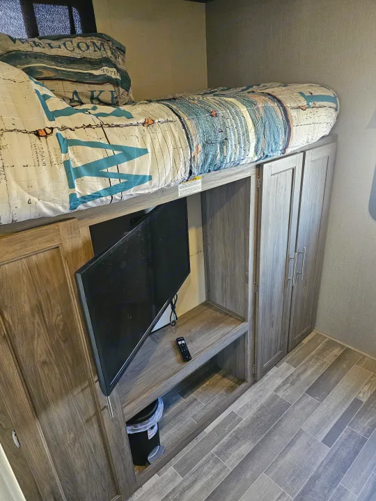RV rental's cozy bunk bed, TV, and integrated storage offer comfort for your travels.. KZ Sportsman 2022