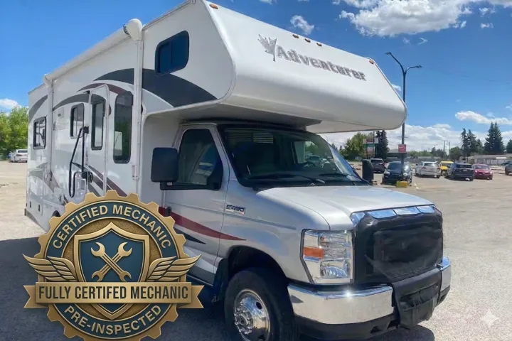 White Adventurer Class C RV rental, Ford chassis, parked on a sunny day. Ideal for memorable road trips.. Adventurer Adventurer Motorhome 2016
