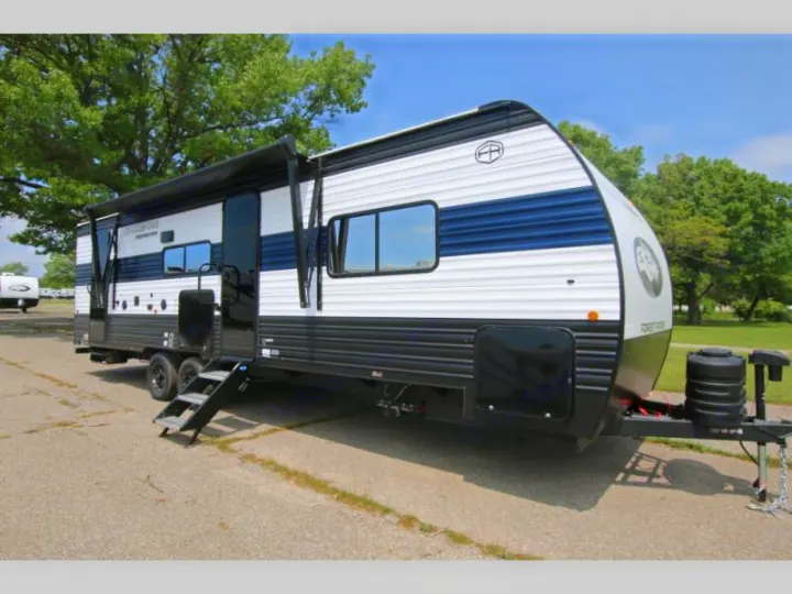 White, black, and blue travel trailer, an excellent RV rental. Features an extended awning and steps. Ideal for your next road trip!. Forest River Cherokee Grey Wolf 26KF 2026