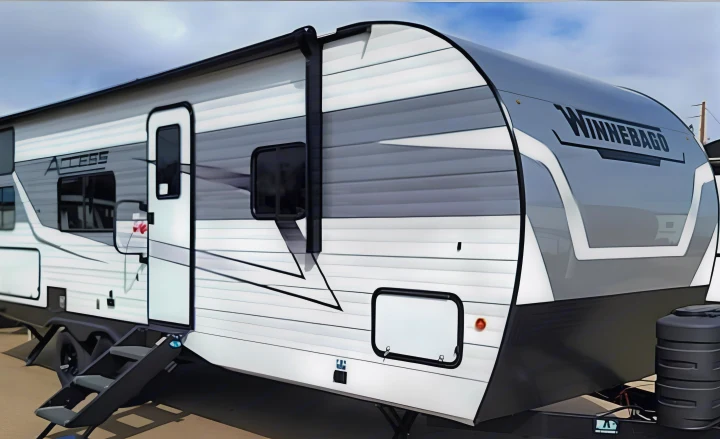 A modern white and grey Winnebago Access travel trailer with exterior steps, perfect for your next rv rental adventure.. Winnebago Access 2025