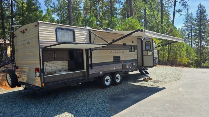 Wildwood RV rental with outdoor kitchen & extended awning, ready for your next adventure travel.. Forest River Wildwood X-Lite 2019