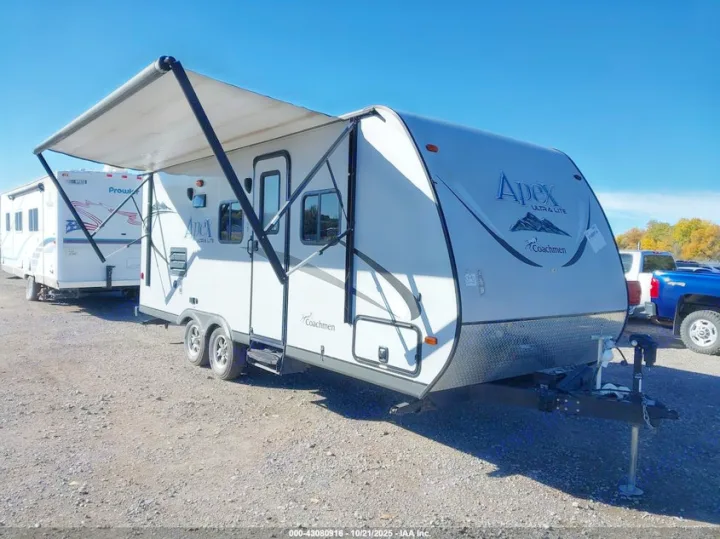 White Apex Ultra Lite Coachmen travel trailer with an extended awning, ready for your next RV rental experience.. Coachmen Apex Ultra Lite 2016