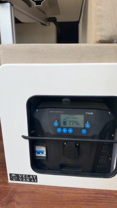 RV rental's Clayton LPS II Lithium Power Supply (Velay Van 43) shows 77% charge and 23 hours remaining.. Renault TRAFIC 2020