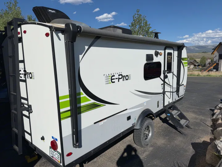 Explore with this white & green Flagstaff E-Pro travel trailer, ideal for your next rv rental adventure.. Forest River Flagstaff E-Pro 2022