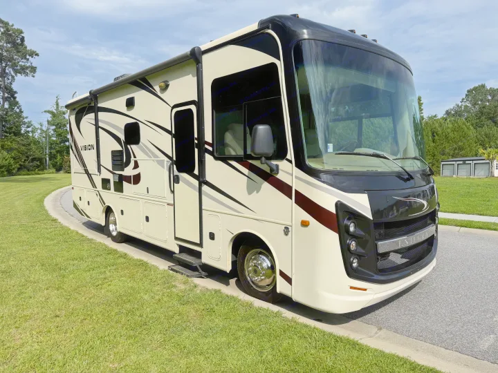 Explore with this spacious Entegra Vision RV rental! A cream motorhome with black accents, ready for your next road trip.. Entegra Coach Vision 2020