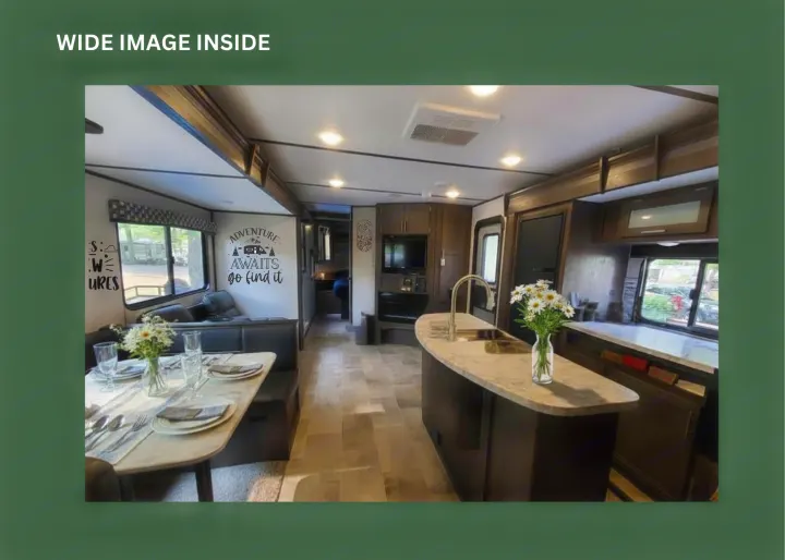 Spacious RV rental interior featuring a modern kitchen island, dining booth, and living area. Perfect for your next adventure.. Dutchmen Coleman Lantern 2020