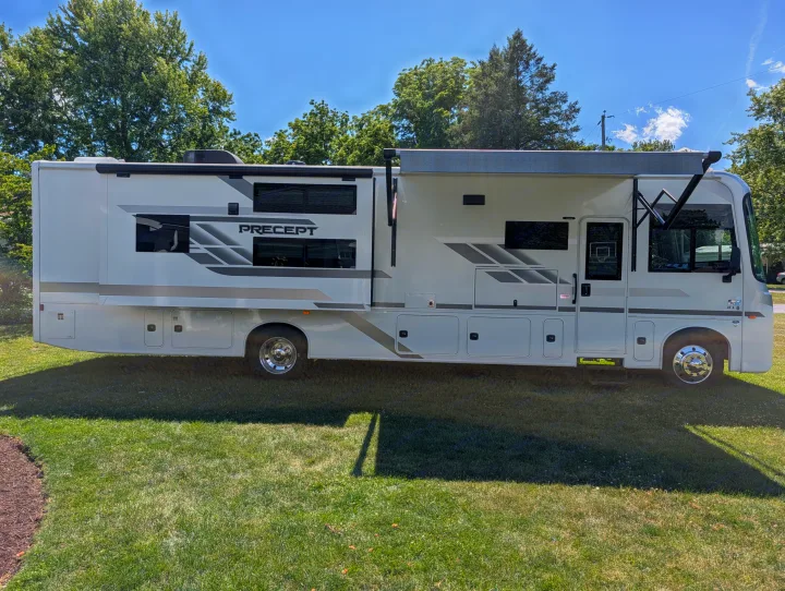 This white Precept motorhome RV rental is parked on a green lawn, ready for your next camping or travel adventure.. Jayco Precept 2025