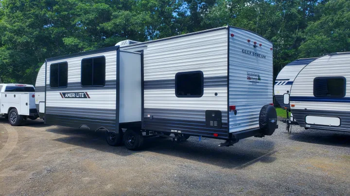 A spacious Gulf Stream Ameri-Lite RV rental with an extended slide-out, ready for your next camping adventure.. Gulf Stream Ameri-Lite 2024