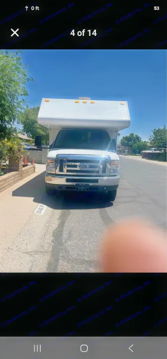 White Ford RV rental motorhome, front view showing its overcab, ready for adventure.. Thor Majestic 2017