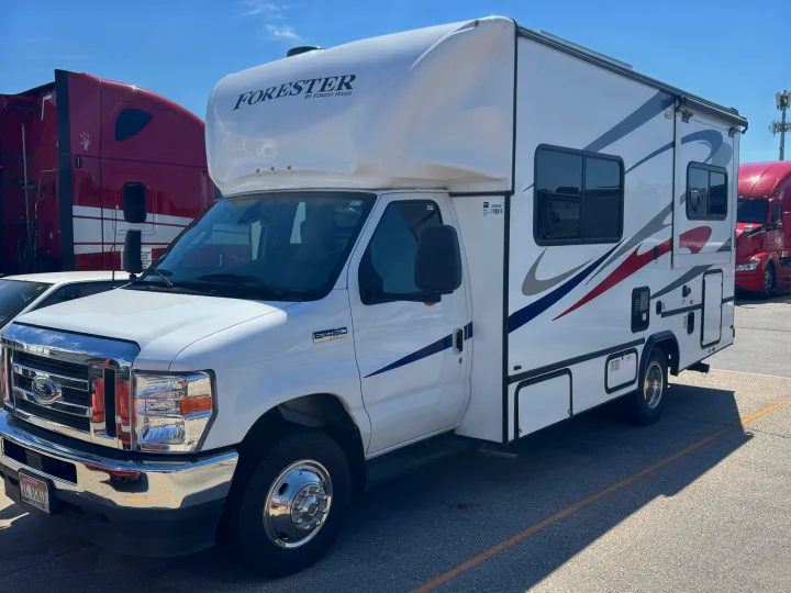 White Forester by Forest River rv rental, a Class C motorhome on a Ford E-450 chassis, parked under a clear sky.. Forester Other 2023