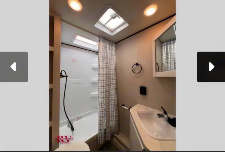 This RV rental bathroom features a compact shower, sink, vanity, and mirror, ideal for mobile living.. Jayco Jay-flight 2026
