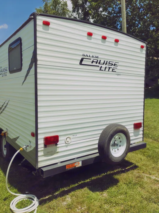 White Salem Cruise Lite travel trailer, available for RV rental from The W, Blue Springs, MO. Spare tire on back.. Forest River Salem Cruise Lite 2014