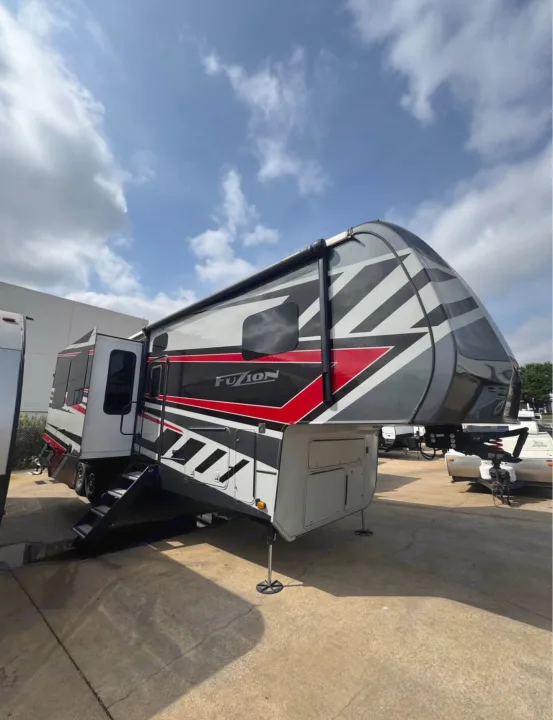 This striking black, red, & white Fuzion fifth-wheel RV is ready for your next rv rental and travel adventure.. Keystone Fuzion 2021