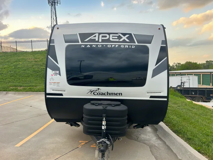Front of a white Apex Nano travel trailer, an ideal RV rental for off-grid adventures. Coachmen brand visible.. Coachmen Apex Nano 2024