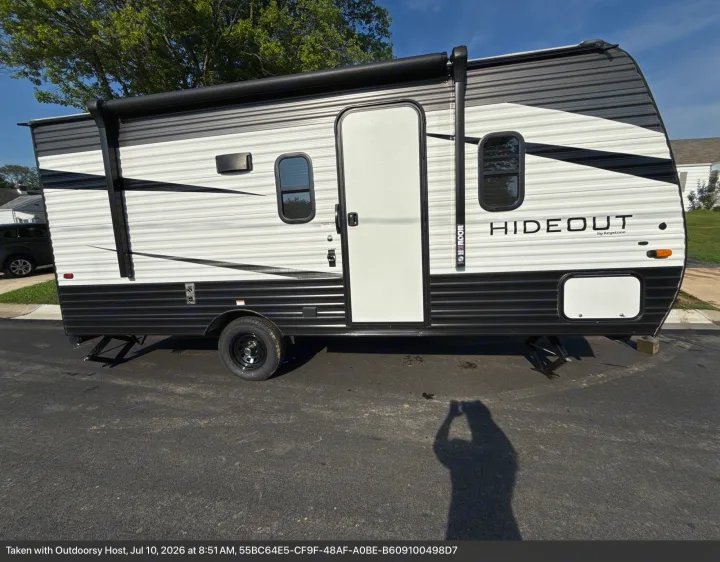 Explore the outdoors! This sharp black and white Hideout by Keystone travel trailer is available for your next RV rental adventure.. Keystone RV Hideout 2021