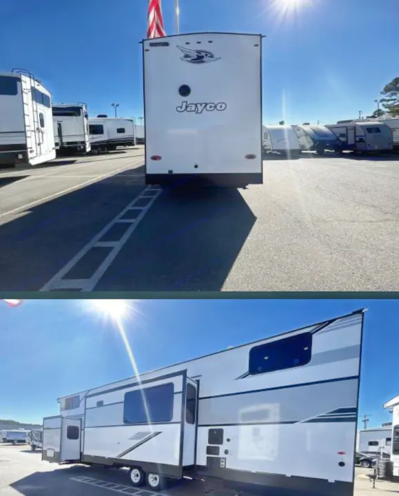 Experience travel with this white Jayco travel trailer rv rental. Pictured from rear and side with slide-outs extended in a sunny outdoor lot.. Jayco Jay Flight Bungalow 2025
