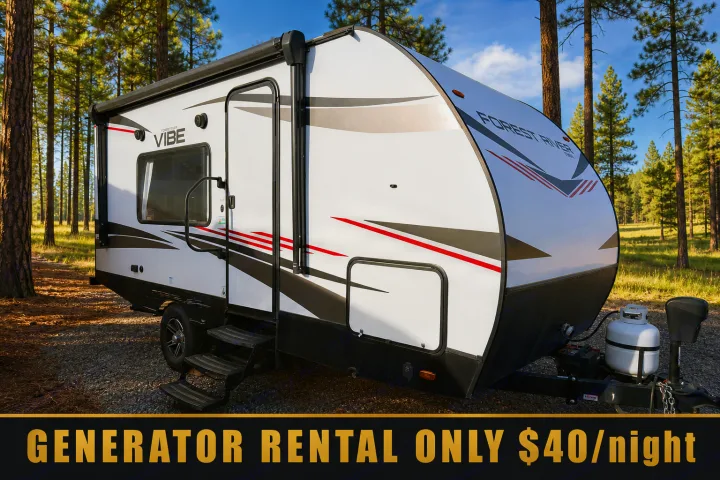 RV rental: A white Forest River Vibe travel trailer in a pine forest, ready for your outdoor adventure. Generator rental $40/night.. Forest River Vibe 2021